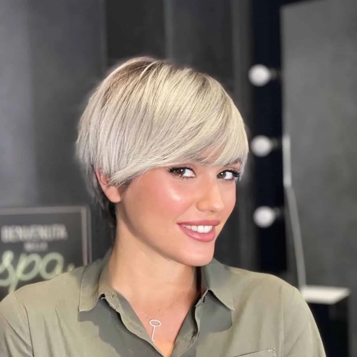 platinum side-swept pixie showing blonde short hair with straight texture for thin fine hair
