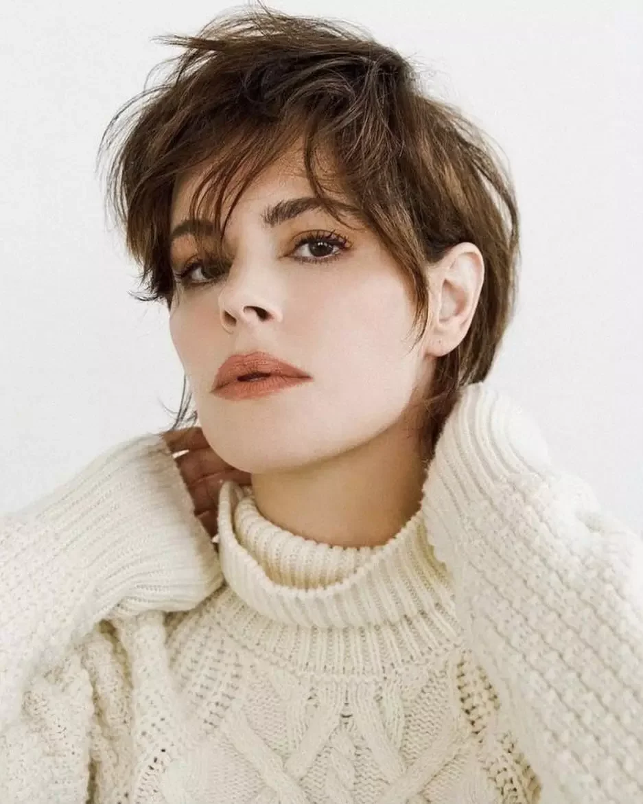 brown pixie shag with bangs showing brunette short hair with wavy texture for thin fine hair