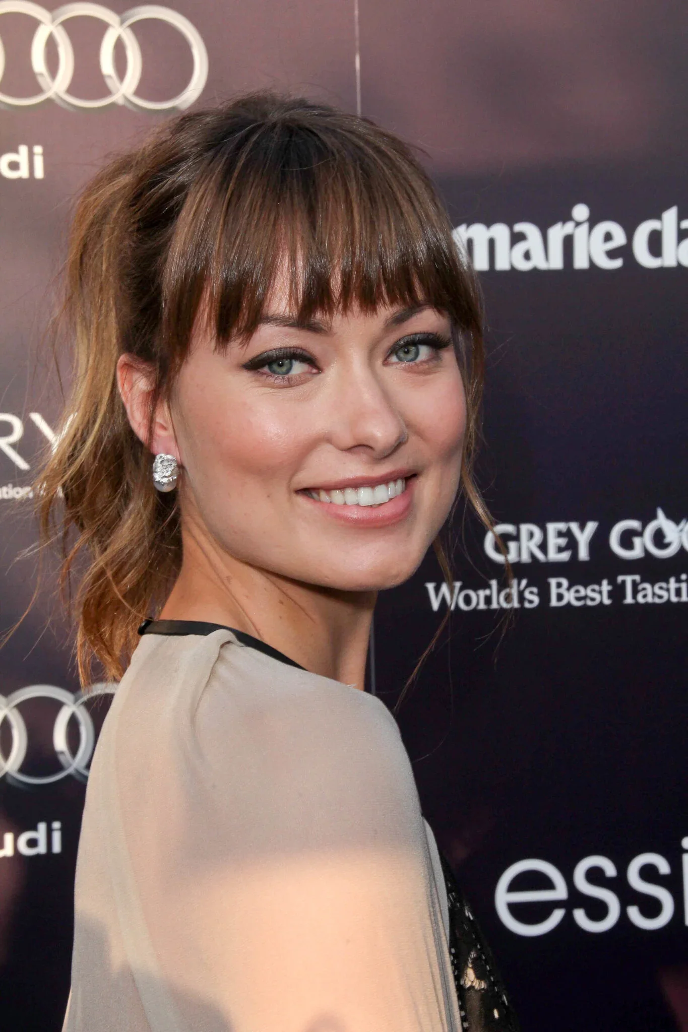 medium straight brunette bangs with wispy fringe shown as a hairstyles for going out idea