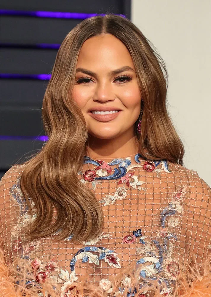 long wavy caramel layers shown as a hairstyles for going out idea