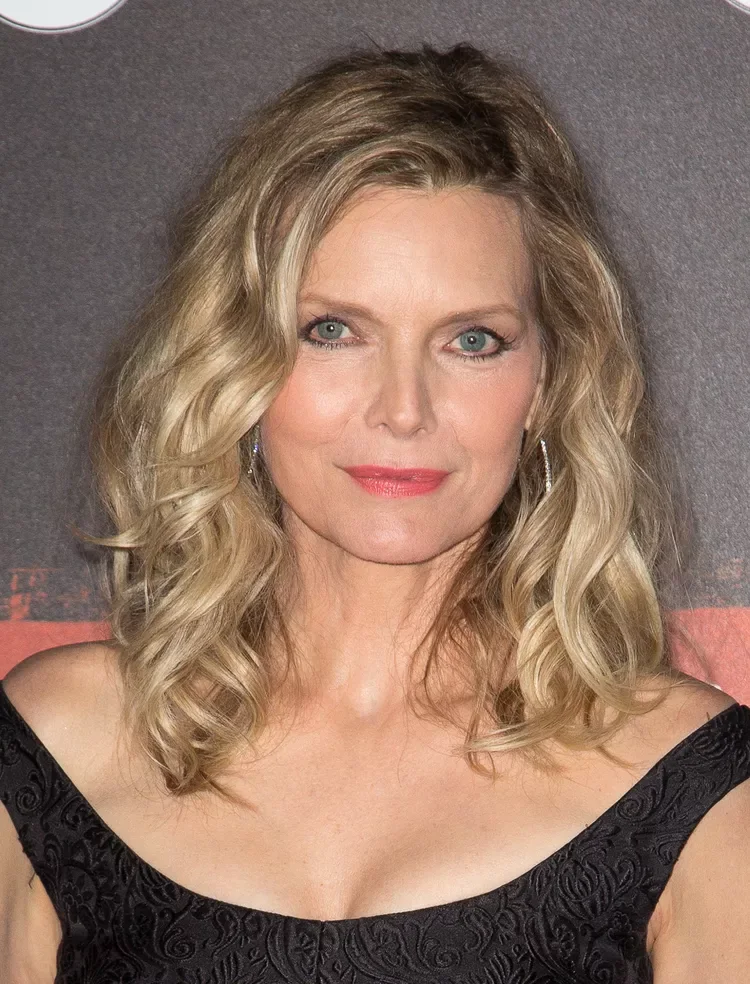 A soft wavy lob with relaxed bends, light layering, and natural fullness around the face. This hairstyle is shown as inspiration for women over 60 with thin hair.