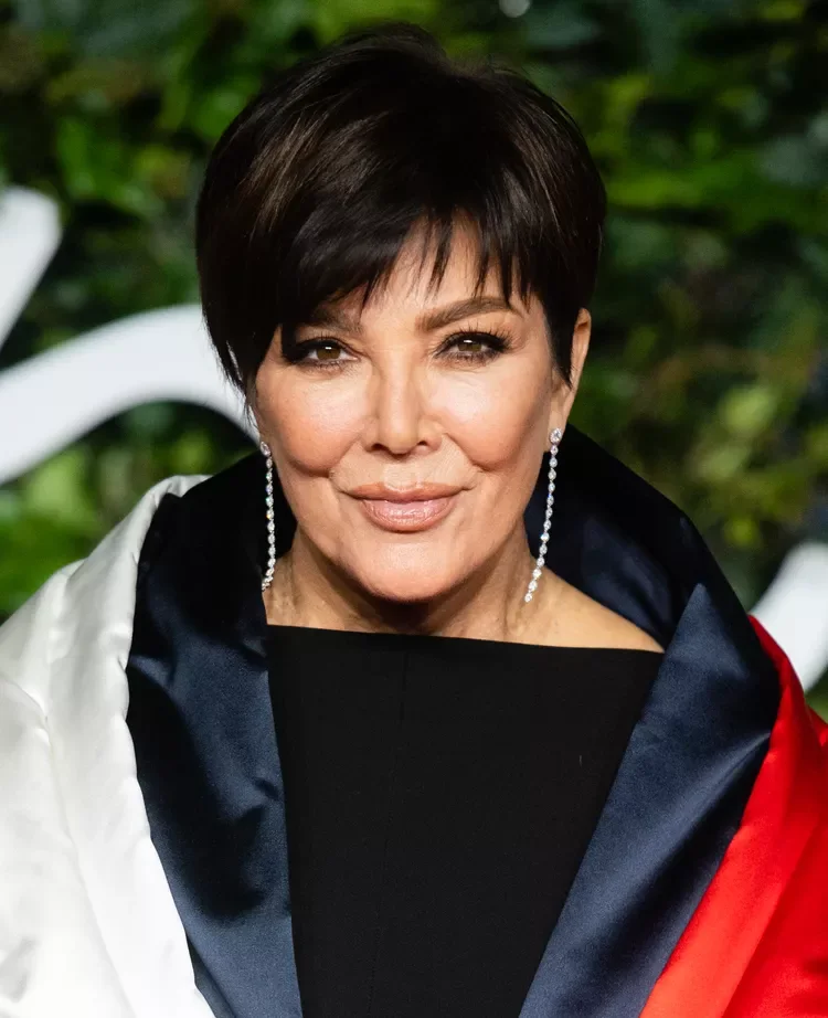 ear straight black pixie with side swept fringe shown as a hairstyles for women over 60 idea