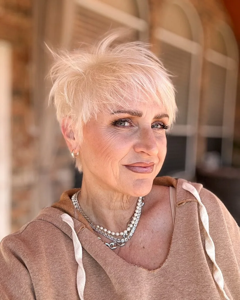 Short blonde pixie with micro bangs on an older woman