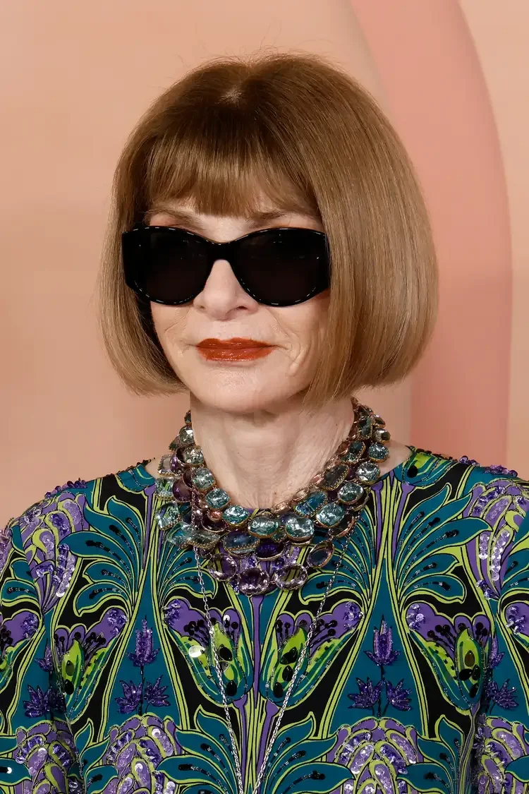 Blunt brunette bob with heavy bangs and sunglasses