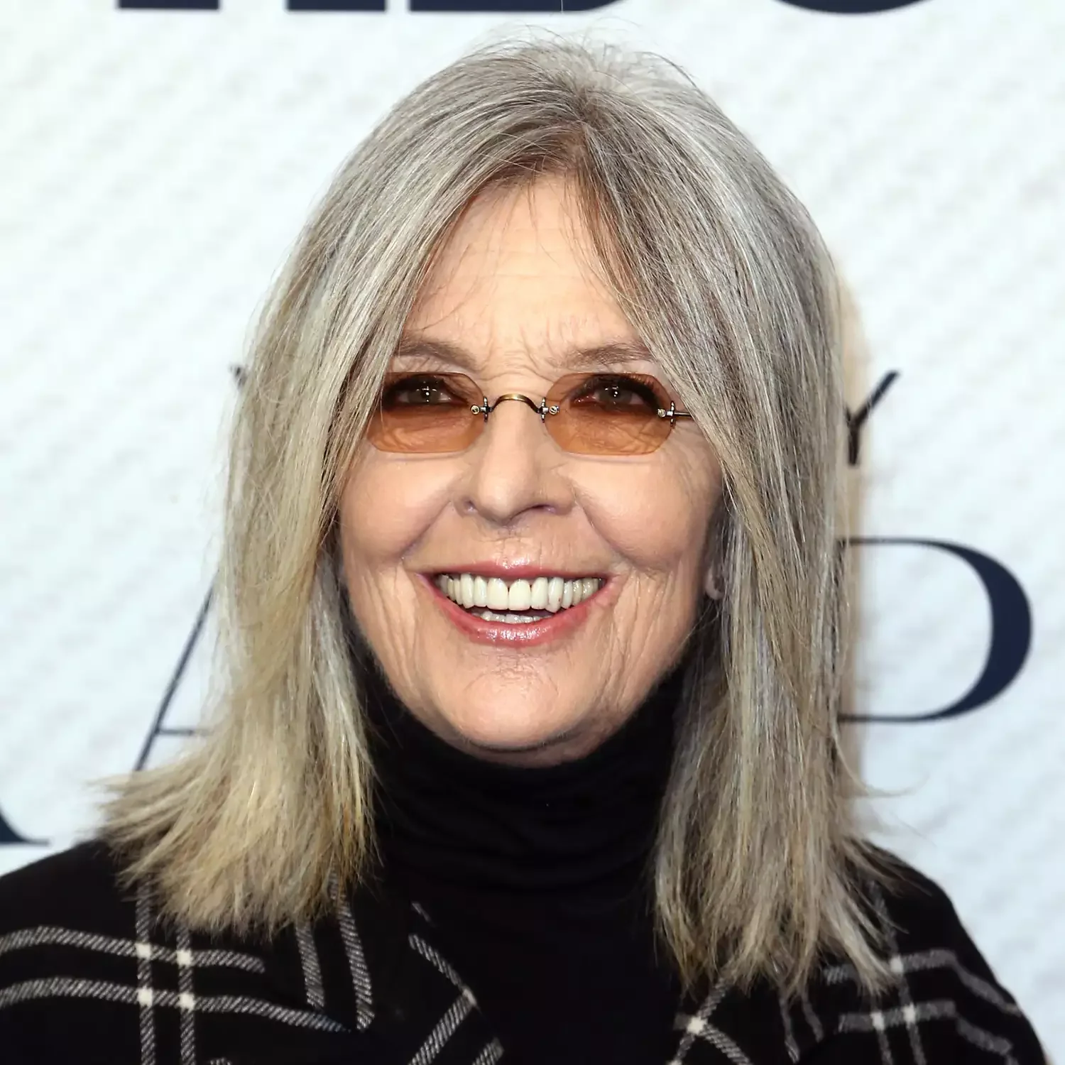 Gray shoulder-length layers with curtain bangs