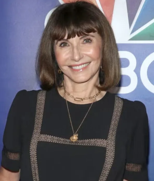 Brunette bob with blunt bangs on an older woman