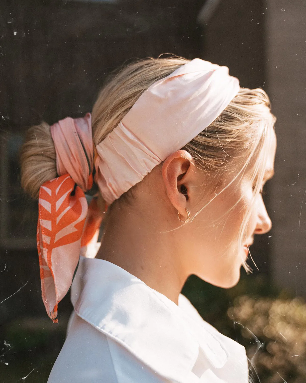 chest straight blonde bun shown as a headband hairstyles idea