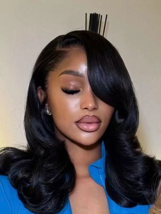 shoulder wavy black layers shown as a hollywood waves idea, featuring medium layering
