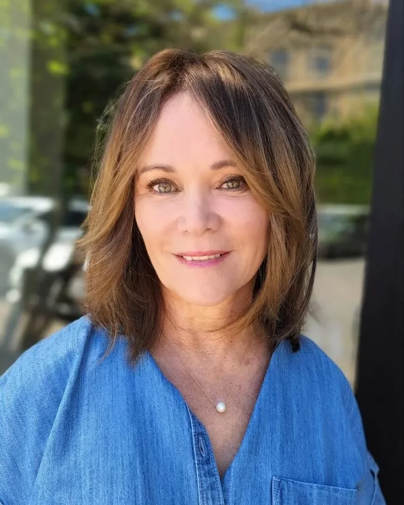 neck straight caramel bob with curtain fringe shown as a layered bob haircuts for women over 60 idea