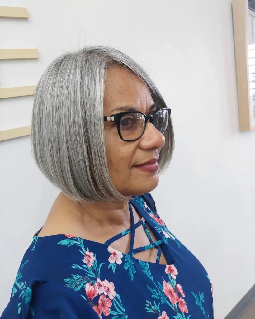 Silver layered bob with glasses and a sleek side shape