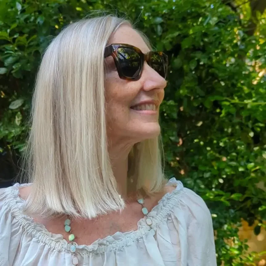Older woman with a straight blonde layered bob
