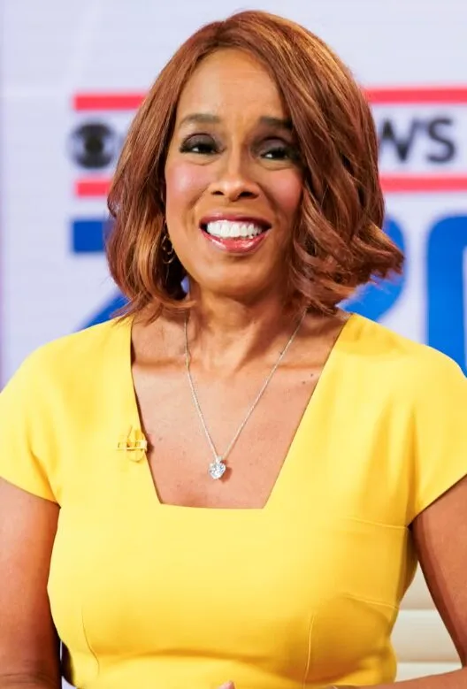 Older woman with a copper layered bob and side volume