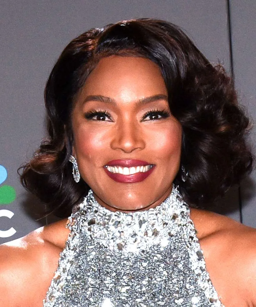 Older Black woman with a soft glam layered bob
