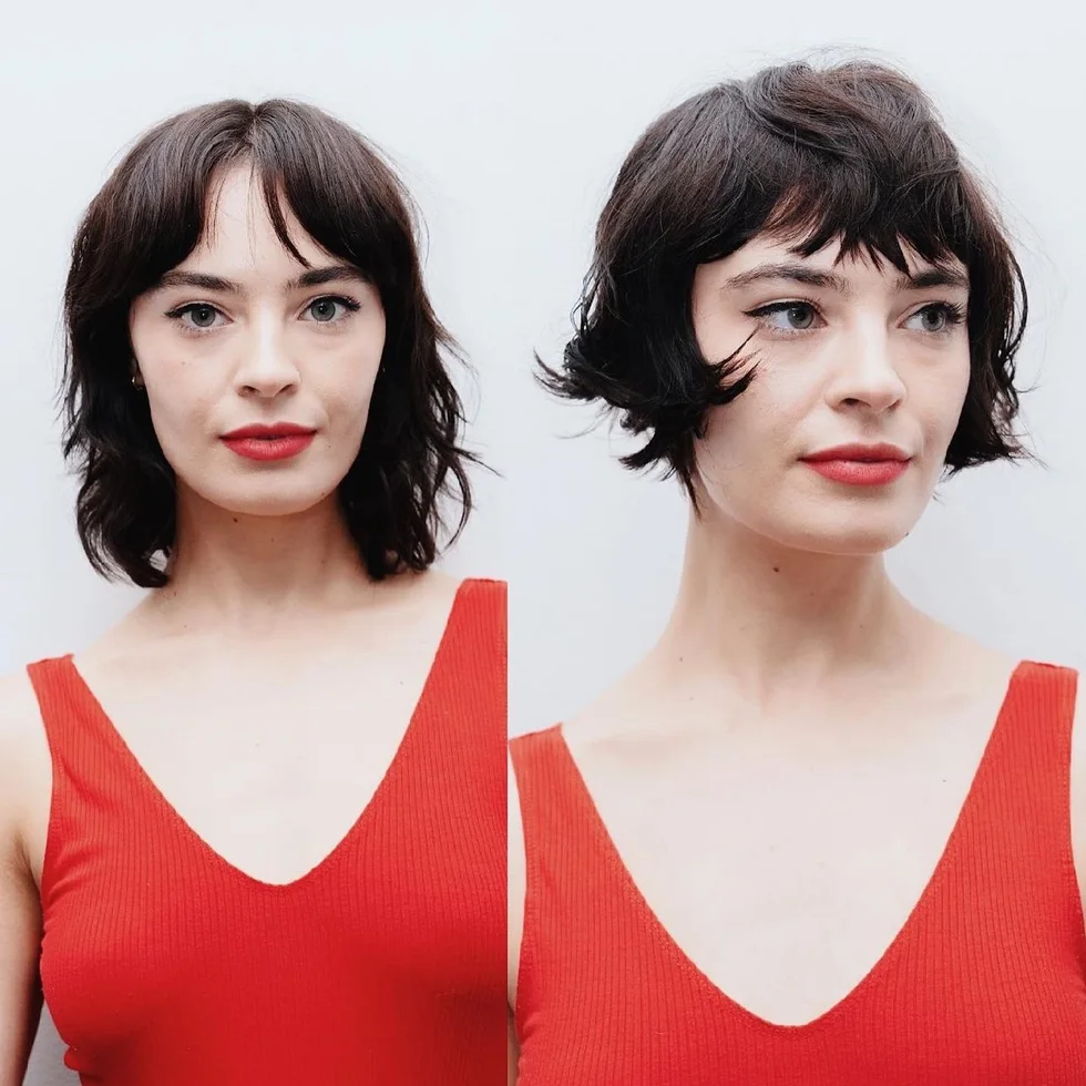 Brunette wavy bob with parted curtain bangs and soft layered ends