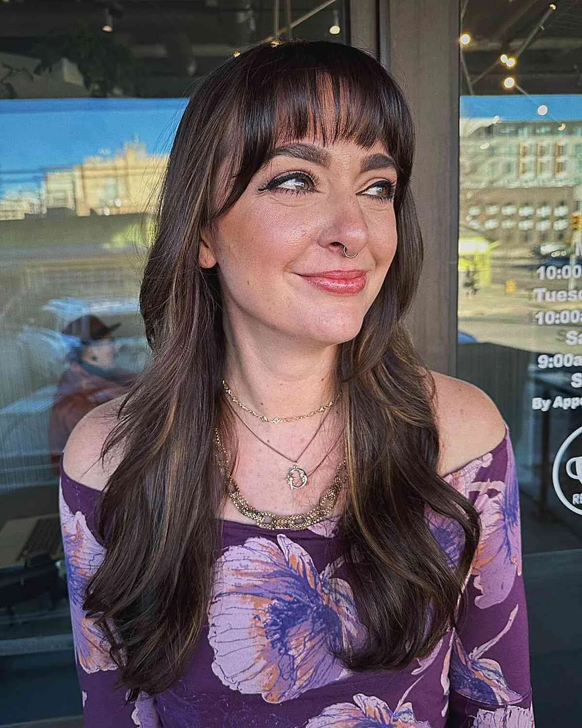 dark wispy layers with bangs showing brunette long hair with wispy bangs and wavy texture