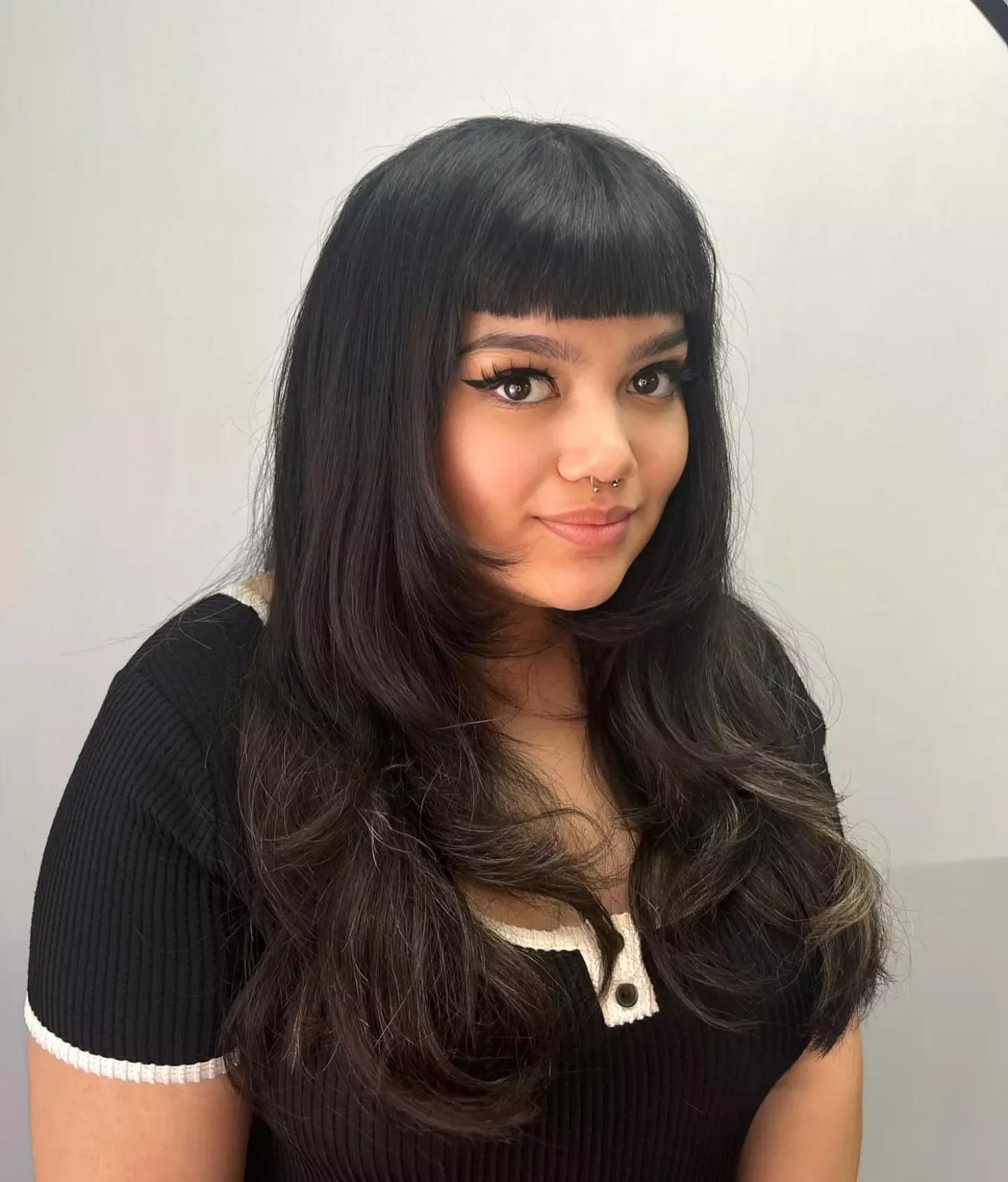black long layers with full bangs showing black long hair with full bangs and wavy texture