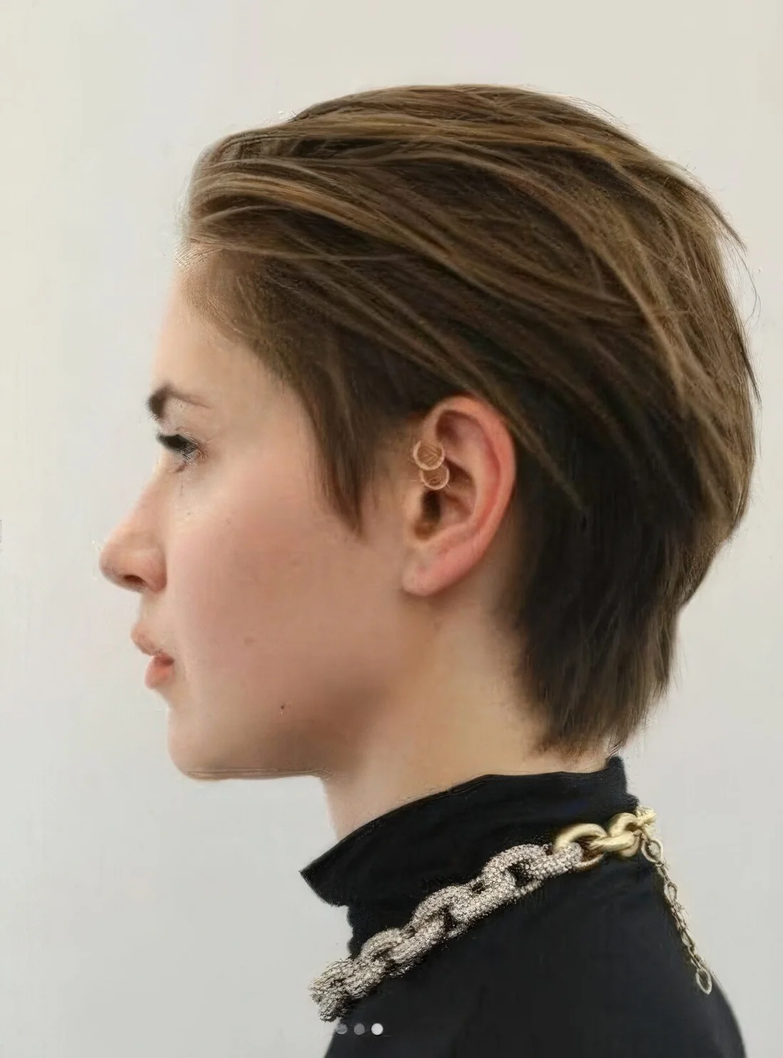 Bixie haircut in brown, with layers and texture.