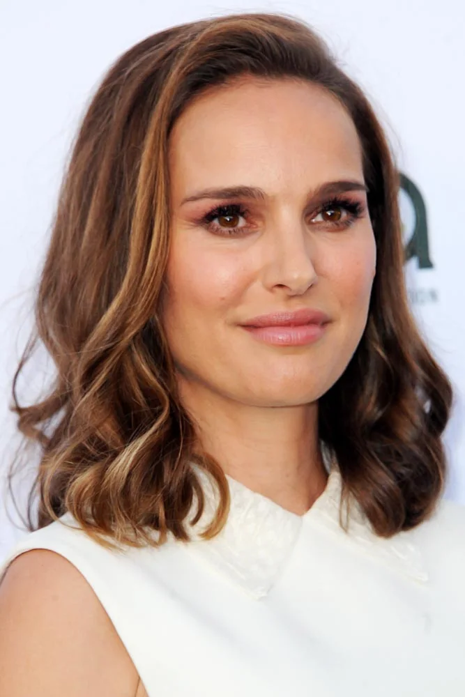 Front view of shoulder-length warm brown hair with softly waved ends