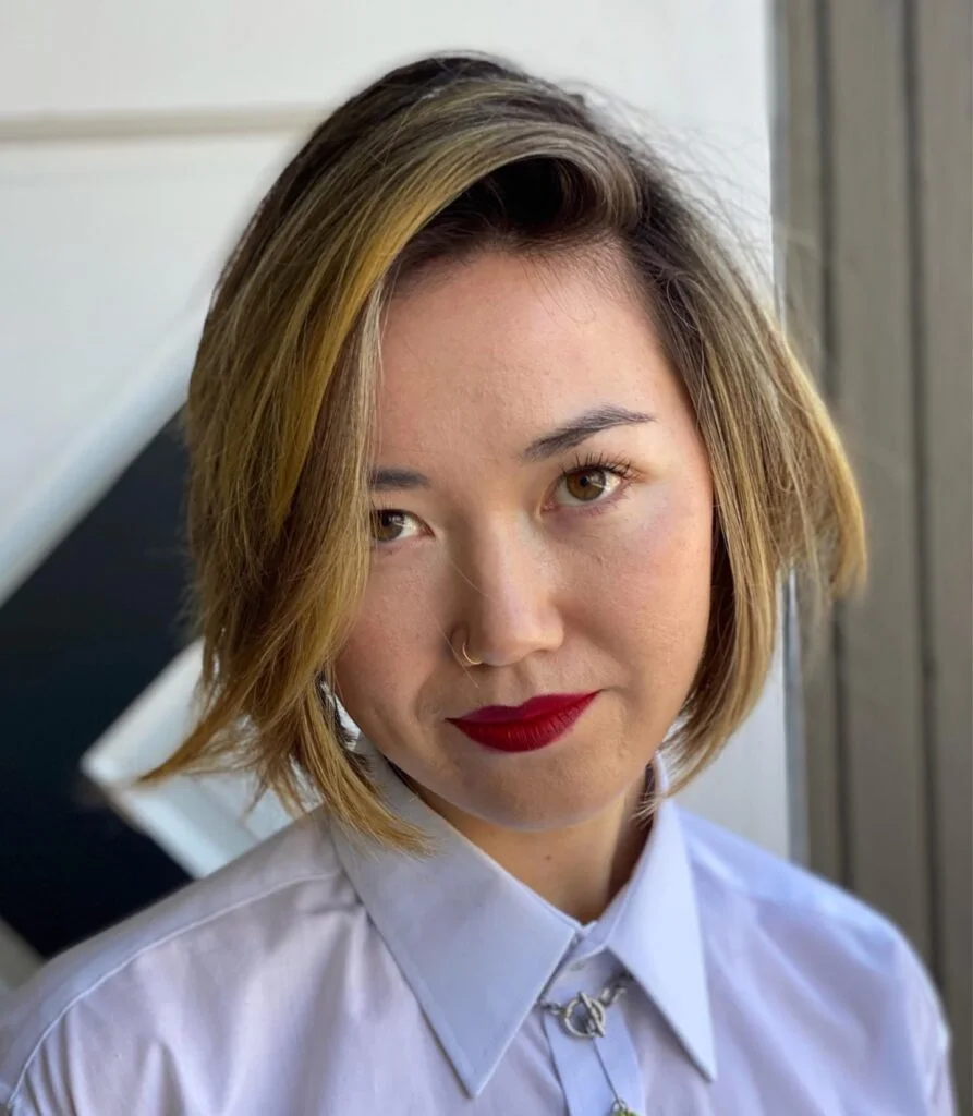 Asymmetric highlighted lob with side part and fuller front for thin hair