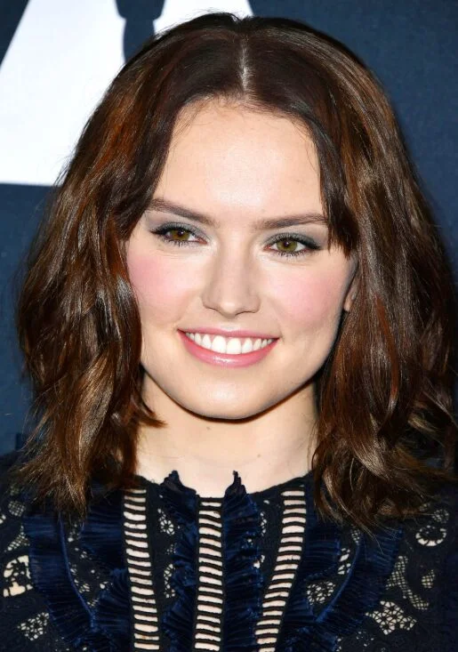 Soft brunette wavy lob with shoulder length movement for thin hair