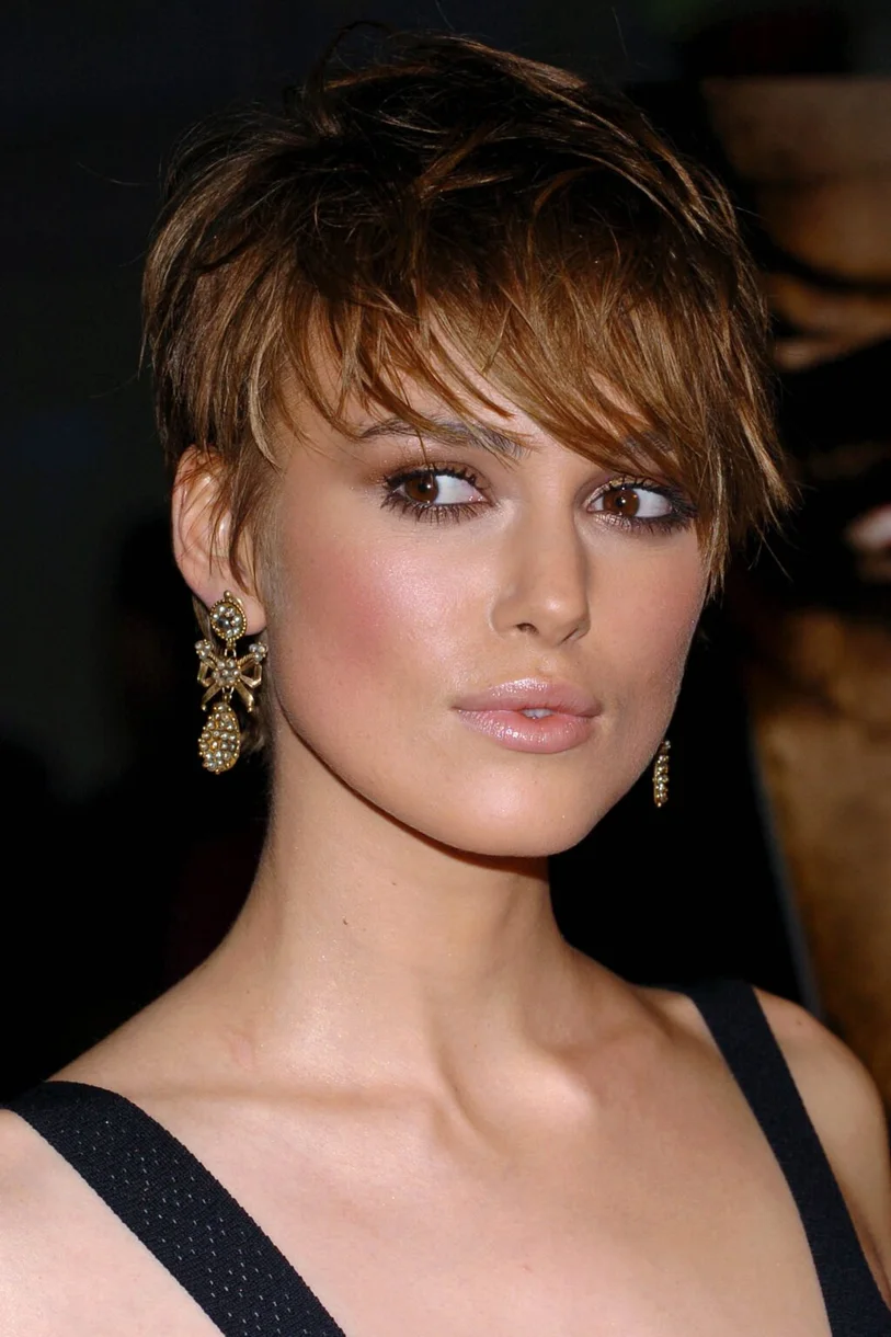 ear straight chestnut pixie with side swept fringe shown as a low maintenance haircuts for fine hair idea, featuring volume through the crown