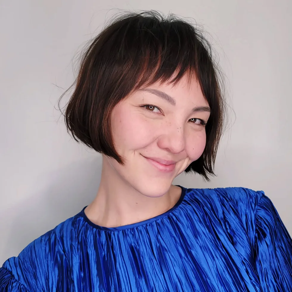 chin straight brunette bob with micro fringe shown as a low maintenance haircuts for fine hair idea