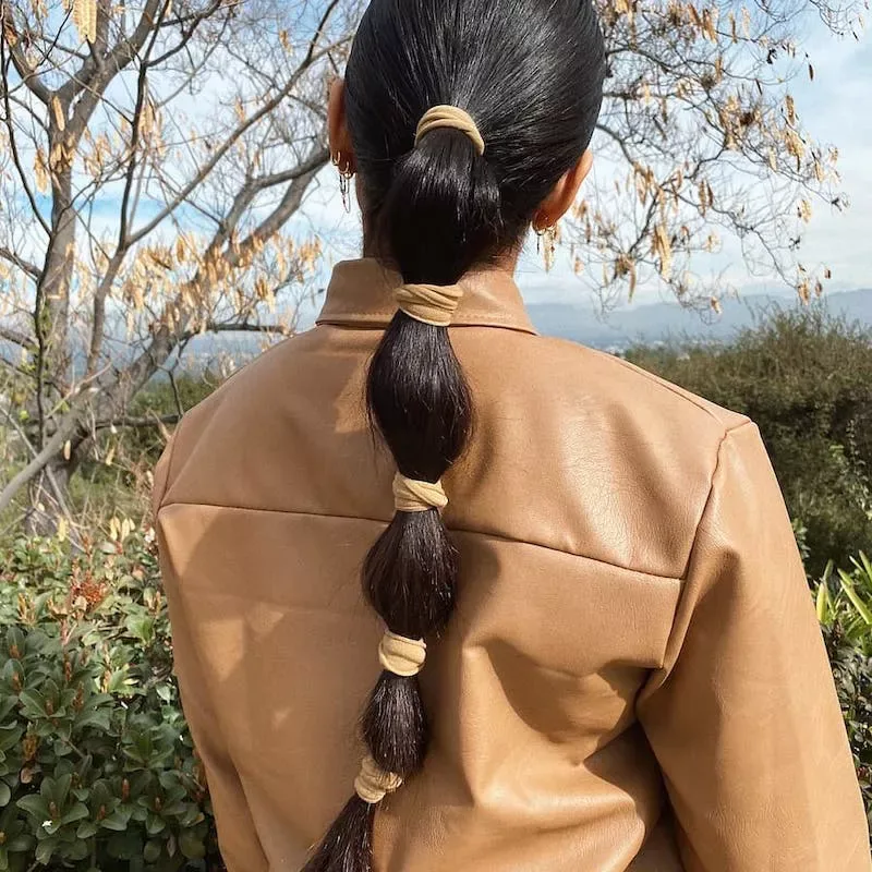 chest straight chestnut ponytail shown as a low ponytail hairstyles idea, featuring volume through the low volume