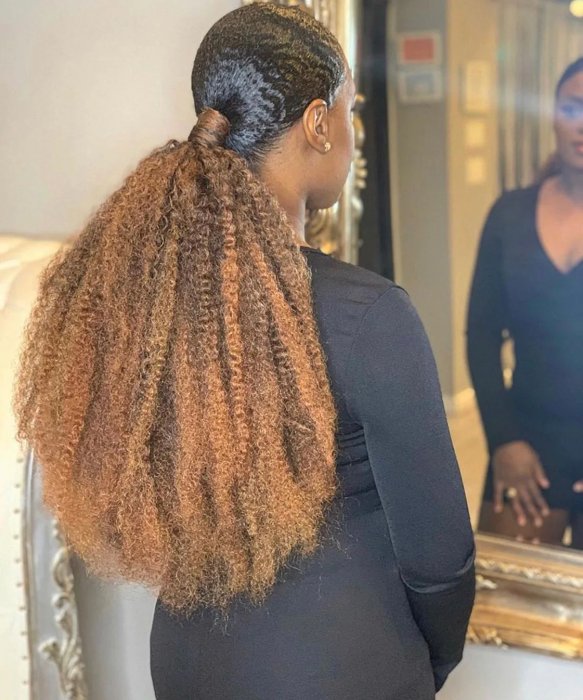 chest coily red ponytail shown as a low ponytail hairstyles idea