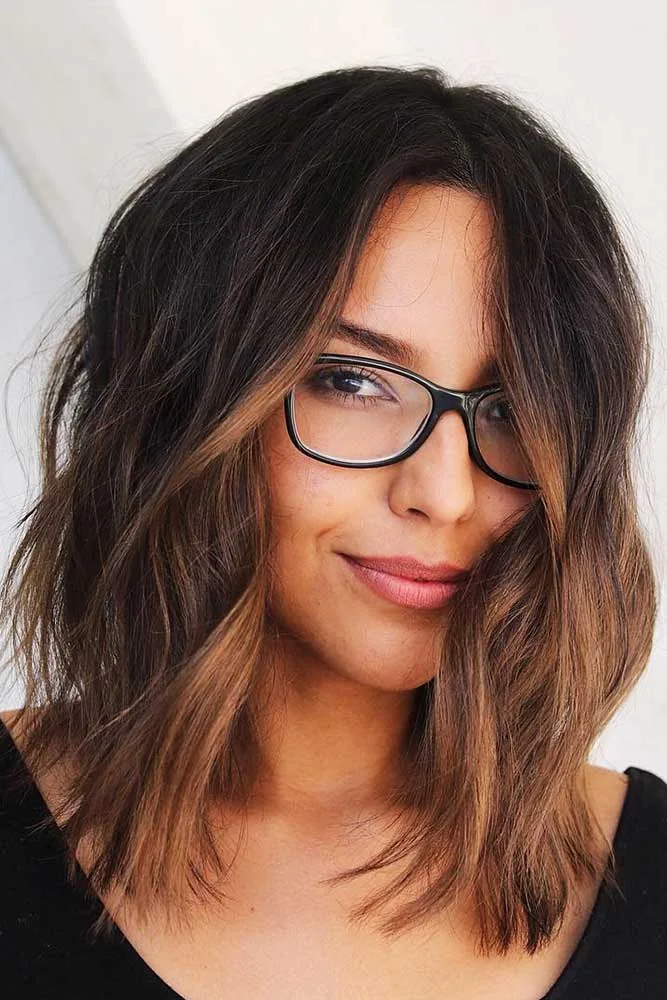 Front view of brown shoulder-length hair with loose bends and an open forehead