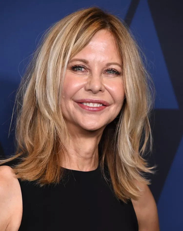 Side-part medium length haircut with soft layers and warm blonde movement for thin fine hair