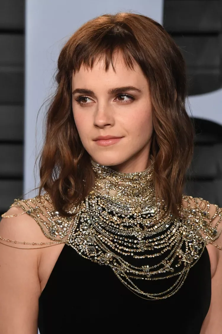 Piecey brunette medium shag haircut with short bangs and textured ends for thin fine hair