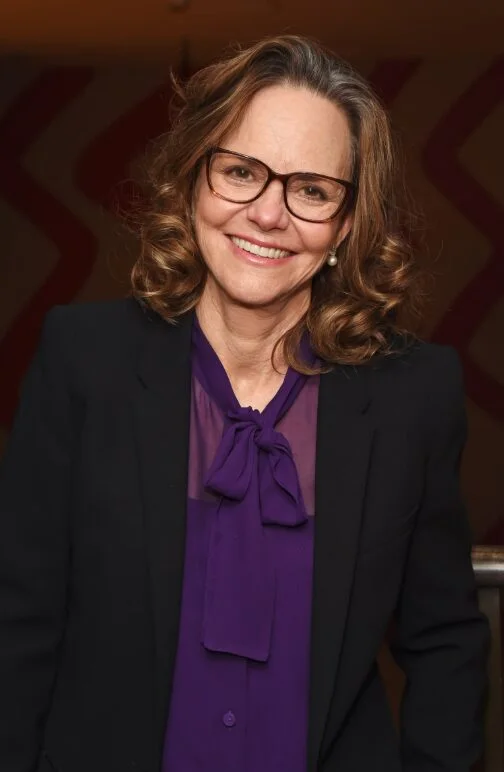 Soft curled medium length haircut with glasses and rounded layers for thin fine hair