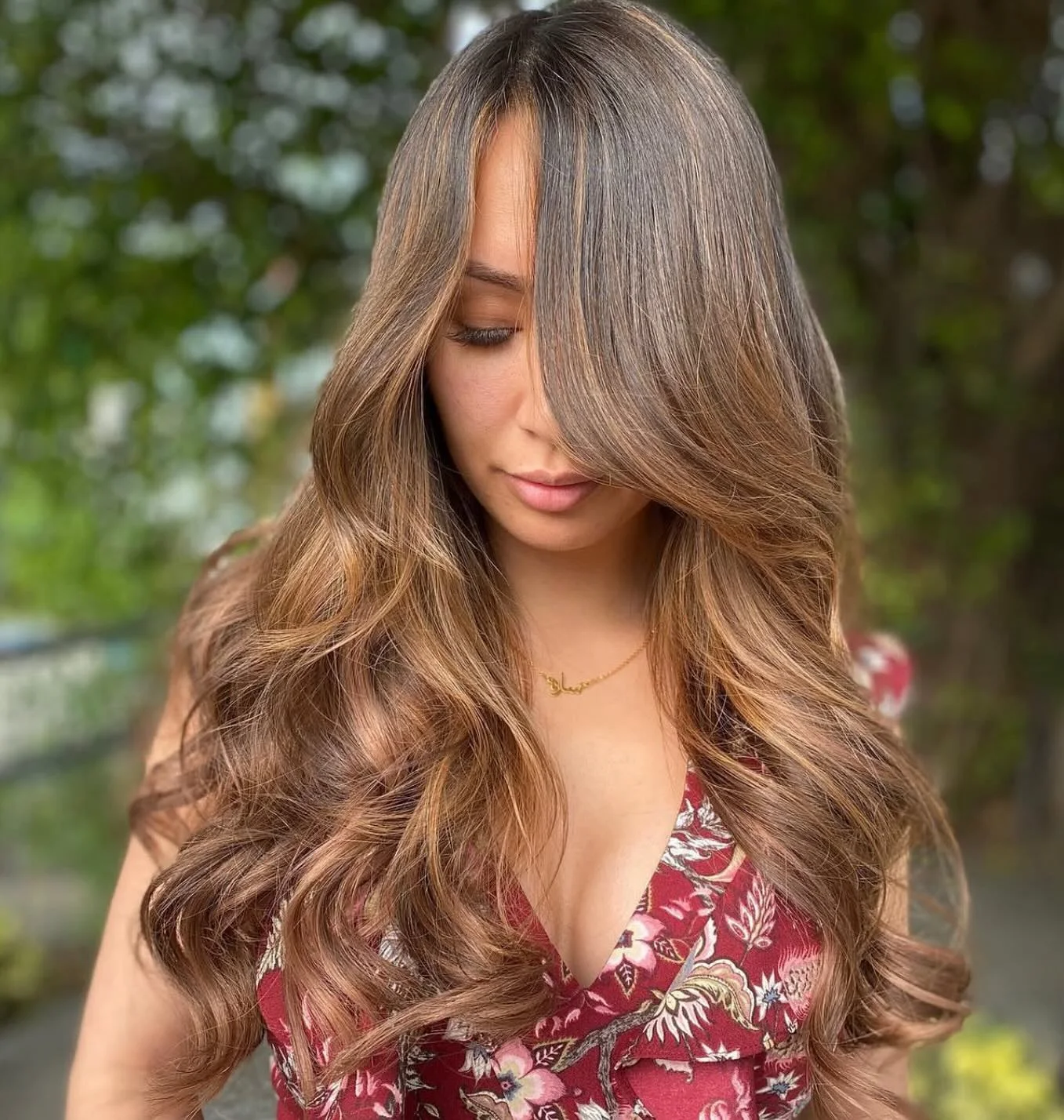 Long medium haircut with soft waves and center part for thin fine hair