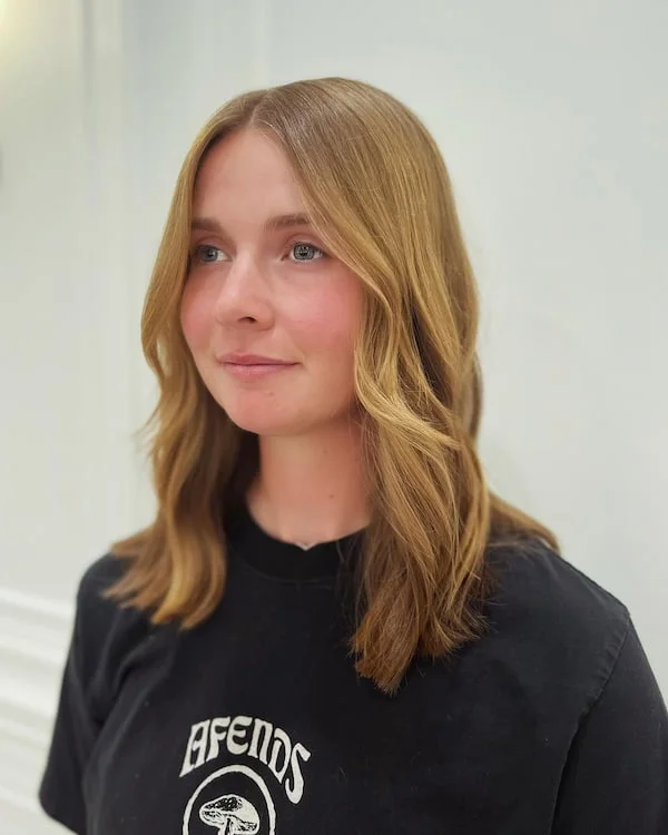 Long blonde shoulder layers with a smooth thick-hair finish