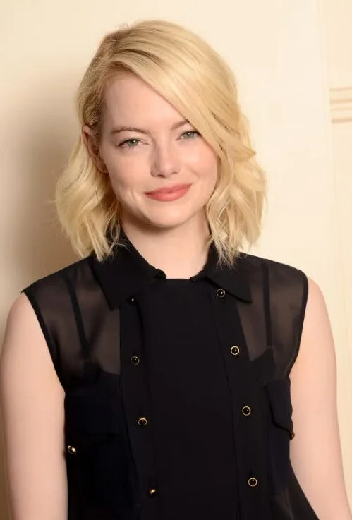 Soft blonde angled lob with textured ends for thick hair