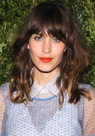 Glossy brunette medium shag with fringe for thick hair