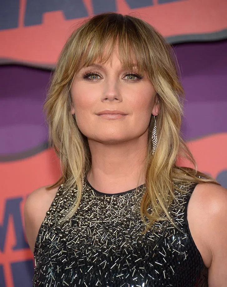 Blonde layered shag with bangs for thick medium hair