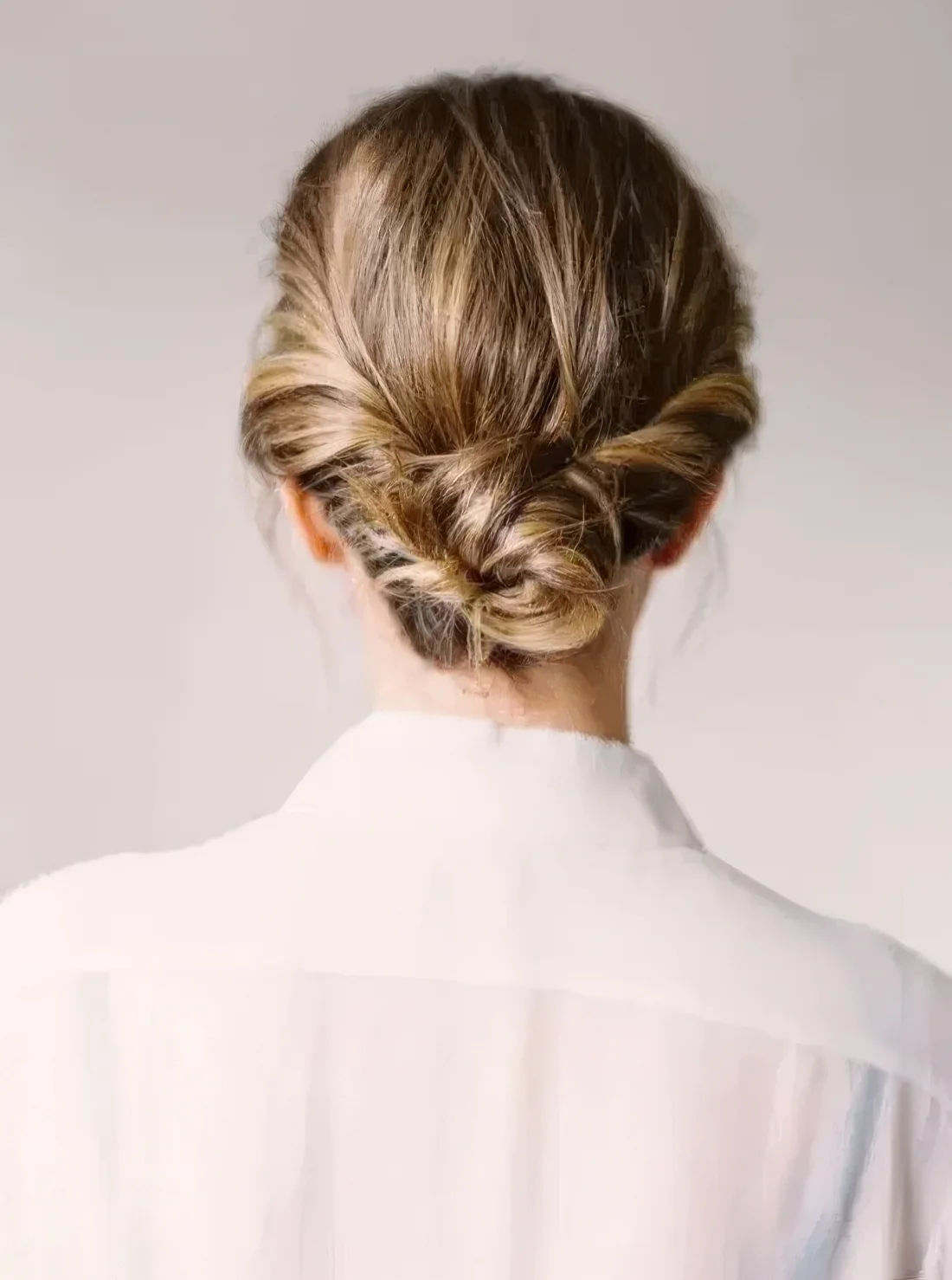 Twisted low bun with a textural top.