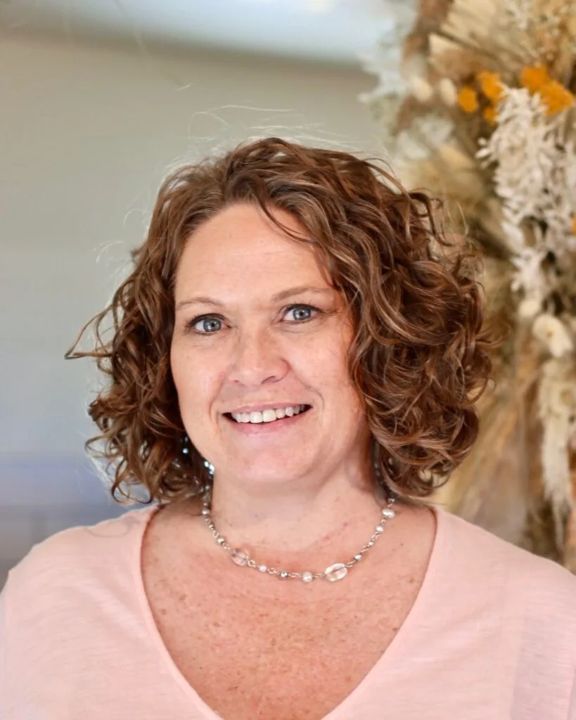 ear curly chestnut curly bob with curly fringe fringe shown as a messy haircuts for women over 60 idea