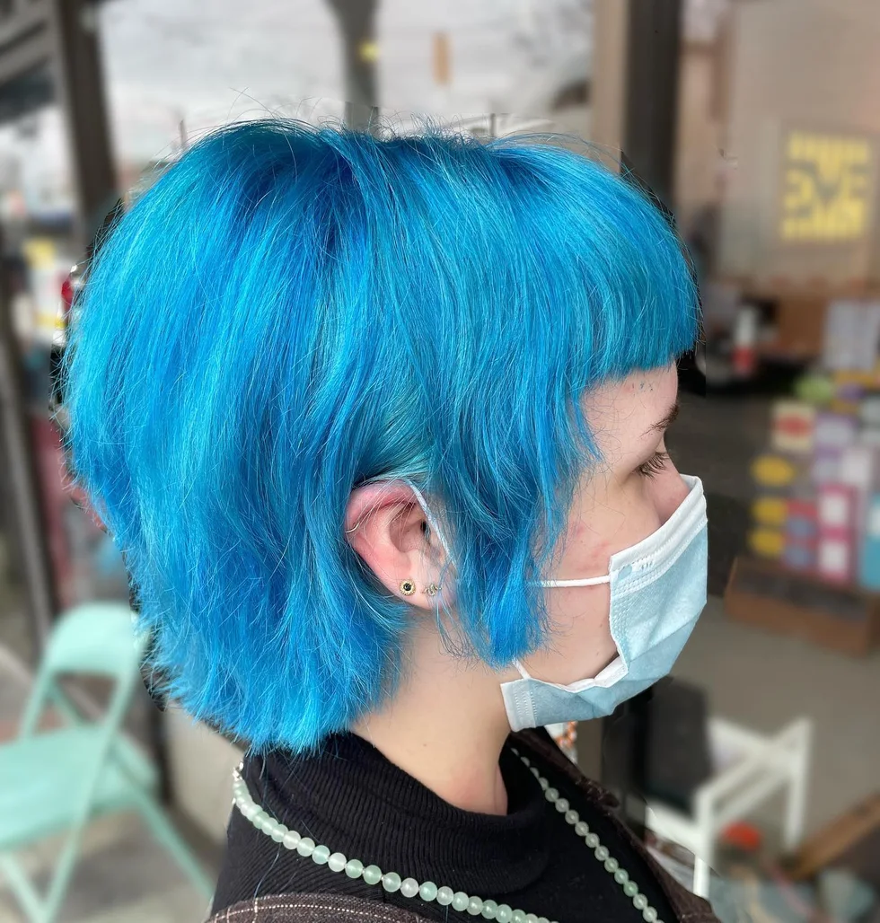 neck straight blue shag with blunt fringe shown as a messy pixie cut with bangs idea