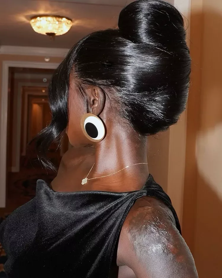 chest straight chestnut bun shown as a mother of the bride hairstyles idea