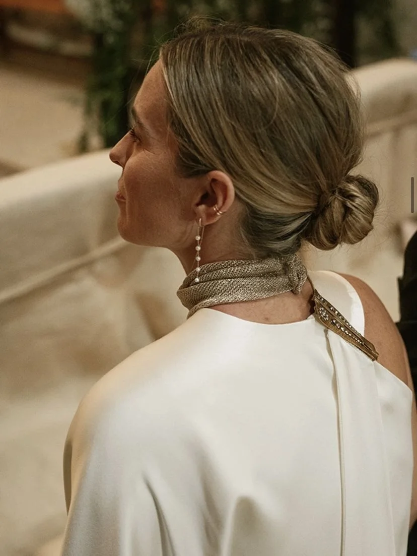 shoulder wavy blonde updo shown as a mother of the bride hairstyles idea