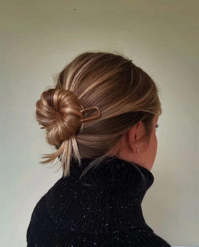 shoulder wavy blonde updo shown as a mother of the bride hairstyles idea, featuring shoulder outline