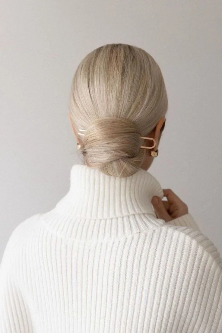 shoulder wavy blonde updo shown as a mother of the bride hairstyles idea, featuring medium layering