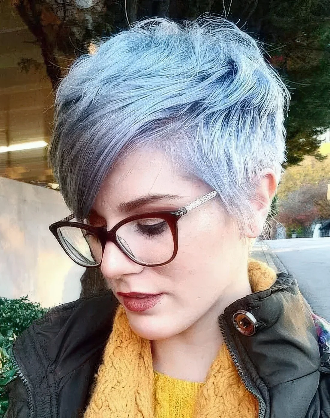 Pastel blue textured long pixie with long side bangs.