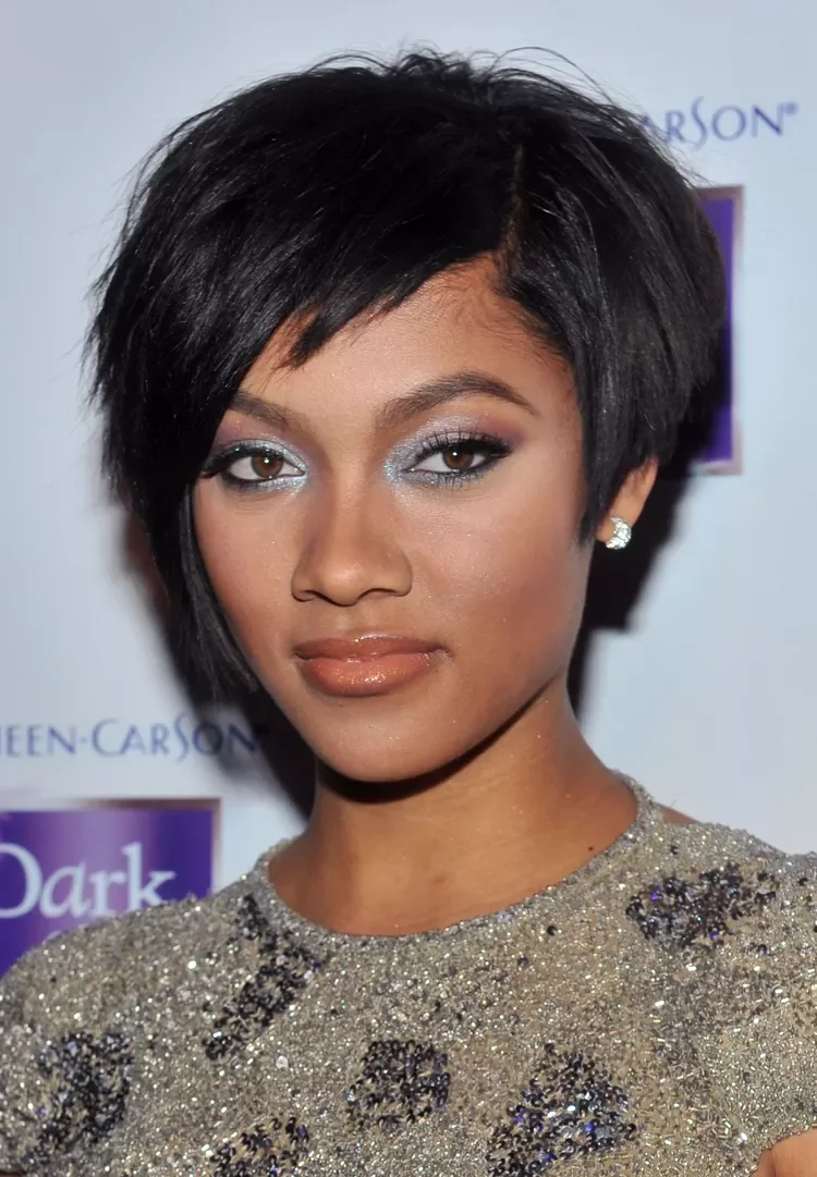 Soft black pixie cut with side fringe and neat short layers