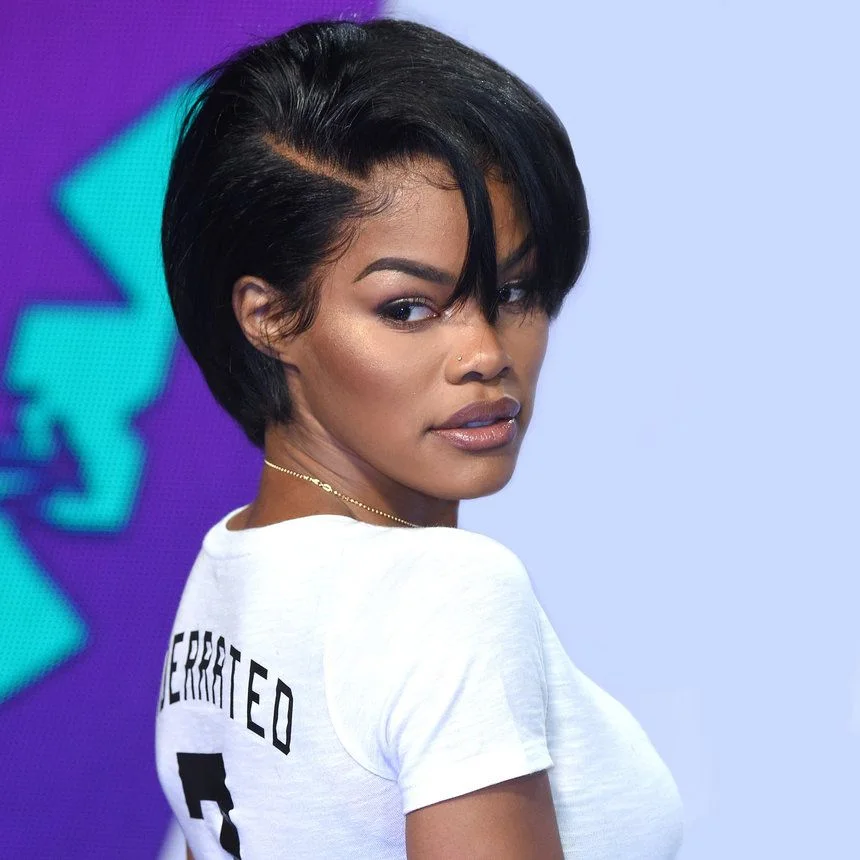 Long black side bang pixie cut with a sleek swept front