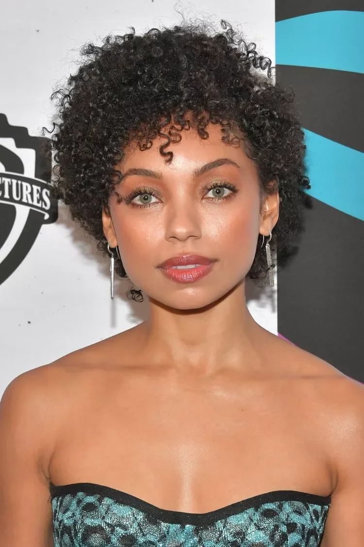 Curly short pixie cut with defined fringe and cropped sides