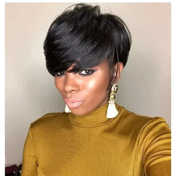 Sweeping black pixie cut with long side bangs and short tapered sides