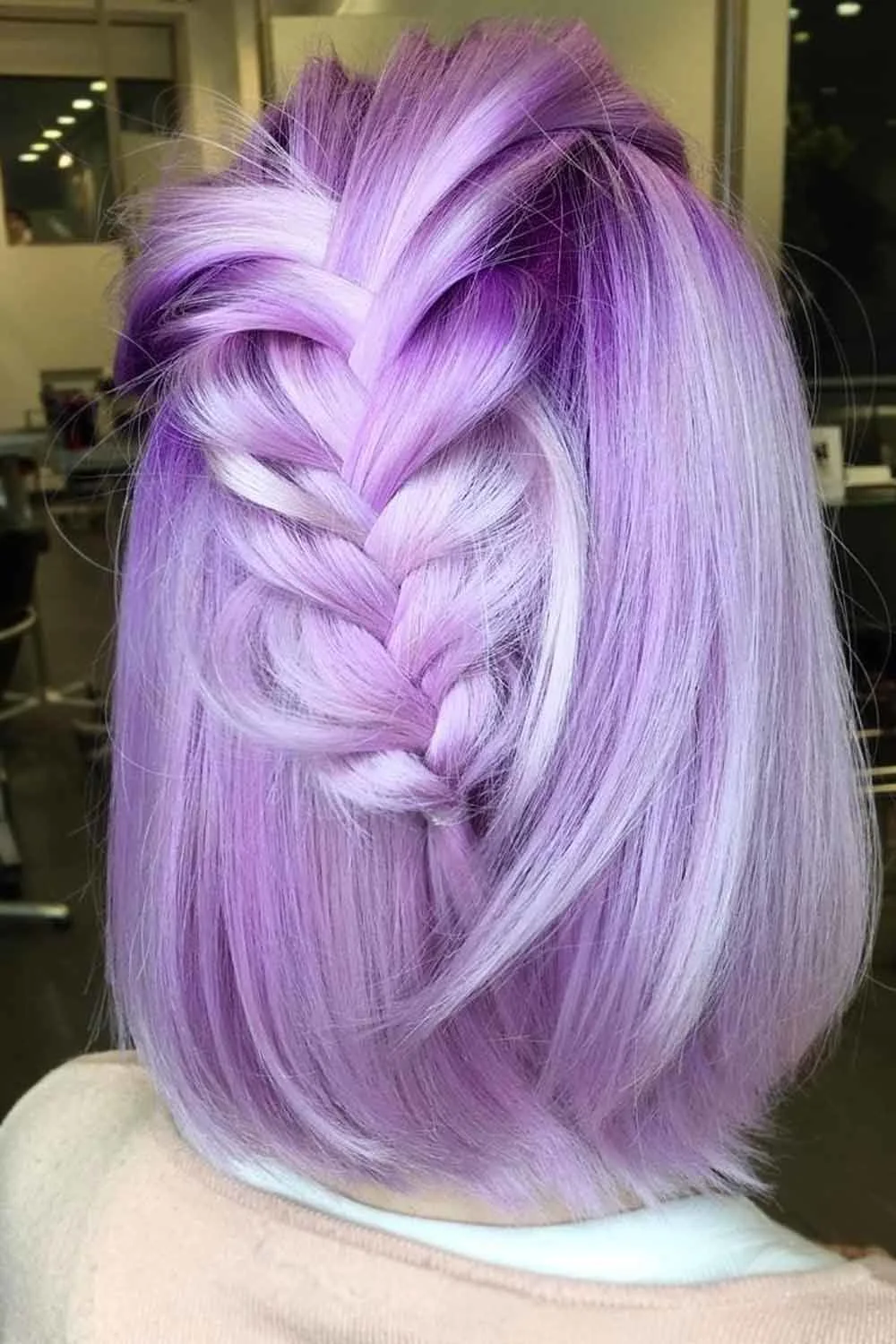 Back view of a lilac bob with one broad half-up braid and straight lower hair